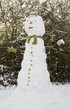 Tall snowman in garden