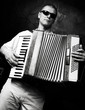 A man plays the accordion A man plays the accordion