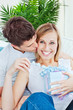 Pleased woman receive a present from her boyfriend