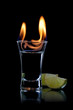 Flaming vodca, and lime over black Flaming vodca, and lime over black