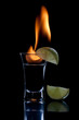 Flaming vodca, and lime over black Flaming vodca, and lime over black