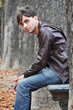 Young man sitting on a bench