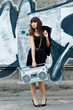 Woman with boom box on the street