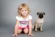cute little girl sitting with a dog