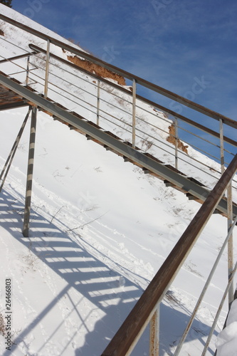 Photo: Stairs with landing against a snow slope Stairs with landing against a snow slope