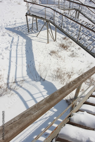 Photo: Stairs with landing against a snow slope Stairs with landing against a snow slope