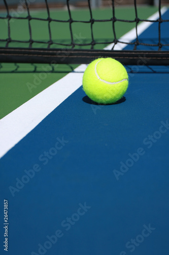 Photo: Tennis ball close to the net Tennis ball close to the net
