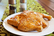 Photo: Uncooked whole chicken on a white plate Uncooked whole chicken on a white plate