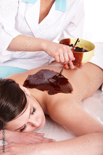 Photo: Girl having chocolate body mask . Girl having chocolate body mask .