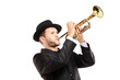 Man in a suit with a hat playing a trumpet Man in a suit with a hat playing a trumpet