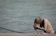 Sadhu rubs his hair with ashes:Haridwar