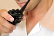 Photo: Portrait of a young housekeeper with wireless radio. Portrait of a young housekeeper with wireless radio.
