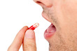 man with red pill closeup