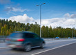 Photo: fast moving SUV car on highway fast moving SUV car on highway