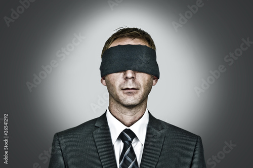 Photo: Man blindfolded Man blindfolded