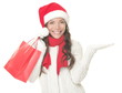 Christmas shopping woman showing copyspace excited