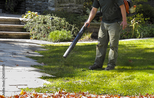 Photo: Landscaper operating Leaf Blower Landscaper operating Leaf Blower