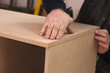 Carpenter Making A Wall Unit