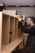 Carpenter Making A Wall Unit