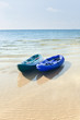 Two kayaks on a tropical beach in Thailand