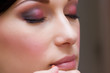 closeup of brunette young lady prepared by makeup artist closeup of brunette young lady prepared by makeup artist