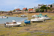 Ships by ebb-tide in harbor of Ploumanach, Brittany, France Ships by ebb-tide in harbor of Ploumanach, Brittany, France