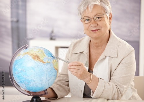 Photo: Senior teacher teaching geography Senior teacher teaching geography