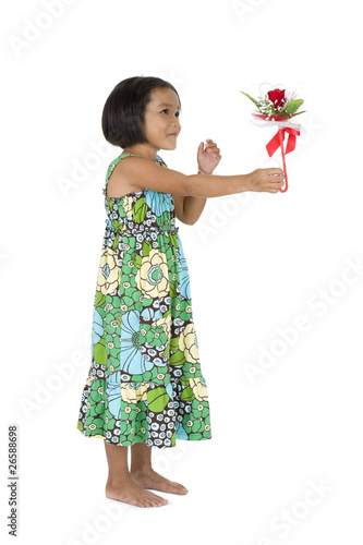 Photo: cute girl with flower gift cute girl with flower gift
