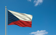 Flag of Czech Republic waving in the wind in front of blue sky