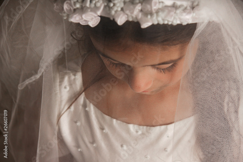 Photo: Girl in Holy Communion Dress with a veil Girl in Holy Communion Dress with a veil