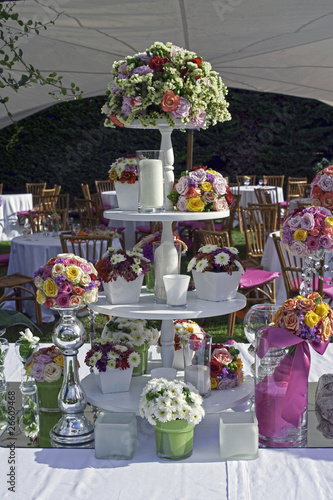 Photo: Beautiful floral table setting for wedding in a garden Beautiful floral table setting for wedding in a garden