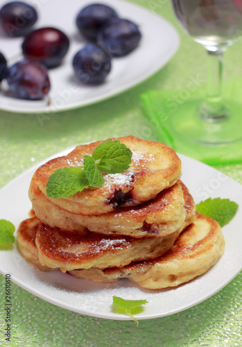 Photo: Blinis (from white flour, with plum) on plate Blinis (from white flour, with plum) on plate