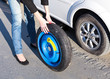 Woman changing the wheel Woman changing the wheel