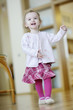 Adorable toddler girl runnig and laughing