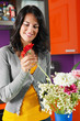 woman arranging flowers in pot