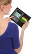 woman holding a touchpad pc, using the music programme