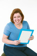 Photo: large woman smiling holding a book large woman smiling holding a book