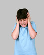 preteen boy holding his head