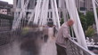 Time lapse of a crowd walking on a bridge