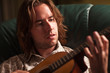 Young Musician Plays His Acoustic Guitar Young Musician Plays His Acoustic Guitar