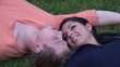 Couple alone together lying on the grass