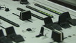 Close up of a sound engineer recording a song in studio