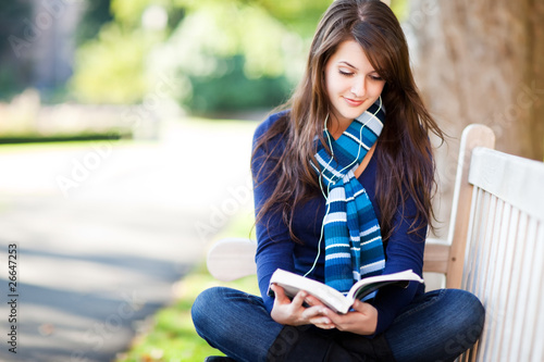 Photo: Mixed race ollege student studying Mixed race ollege student studying