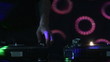 Front view of a Dj mixing in a discotheque
