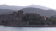 Front view of a castle lining the sea
