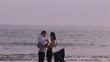 Video: Happy parents with their child on the beach Happy parents with their child on the beach