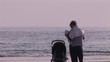 Video: Young couple with their baby on the beach Young couple with their baby on the beach