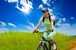 woman with bike on green field woman with bike on green field