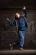 Hip hop dancer in modern style over brick wall