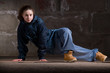 Hip hop dancer in modern style over brick wall